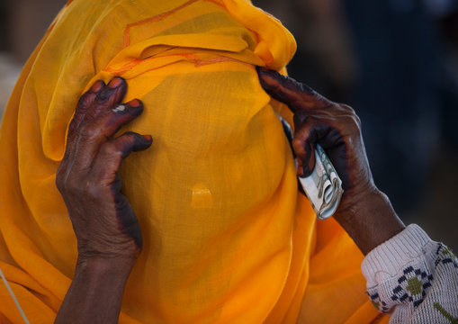 Woman hiding her face, Adi keyh, Eritrea