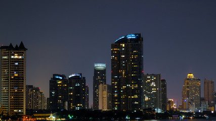 Business architecture, skyscrapers and light trails, Close shot of skyscrapers with lights, Night building.