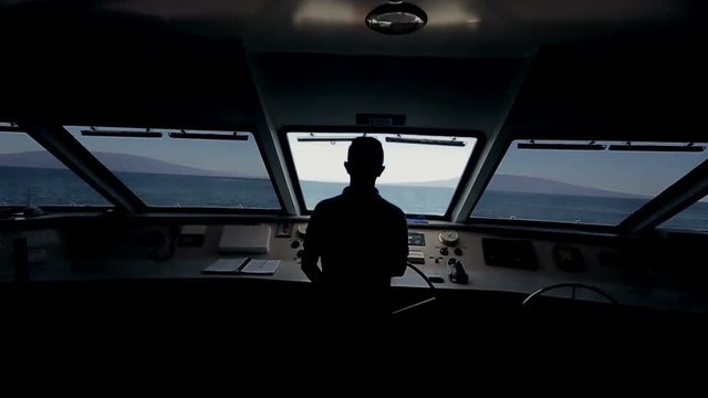Captain on deck of large ship