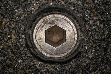 Macro shot of hex head bolt screw thread. Close up view of rustic hexagon screw head