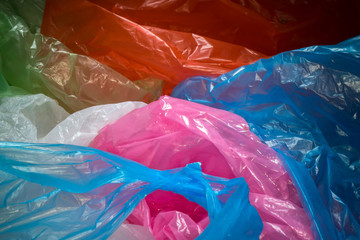 Fototapeta premium Disposable plastic bags background. Lightweight transparent, reusable plastic waste. Rubbish bags, plastic recycling, environmental issues