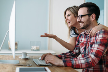 Young attractive designers working on project together