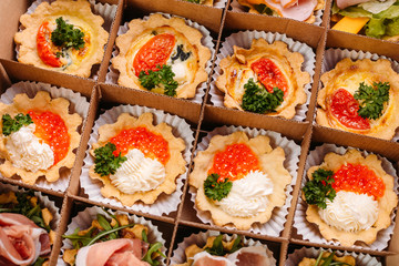 Collection of take away kraft boxes with  different food. Set of containers with everyday meals - meat, vegetables and law fat snacks on white background, top view. 