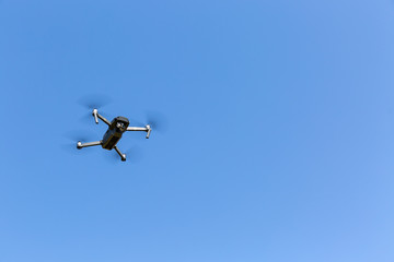 A drone flying against the blue sky