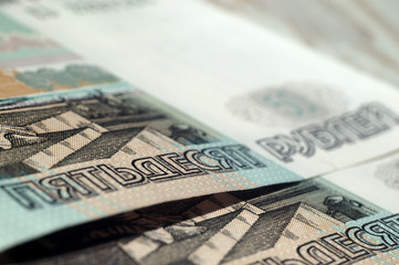 Fragment of fifty ruble notes closeup. Shallow depth of field