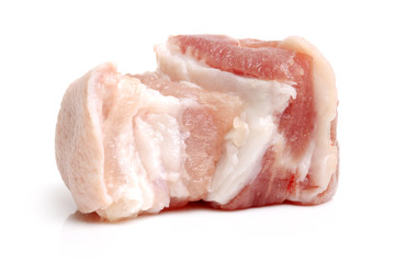 Raw pork belly pieces on a white background