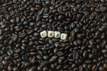  coffee roasted and text wood cube close up image.