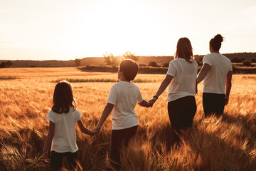 Happy and fun family in nature. Concept of united family having fun and smiling
