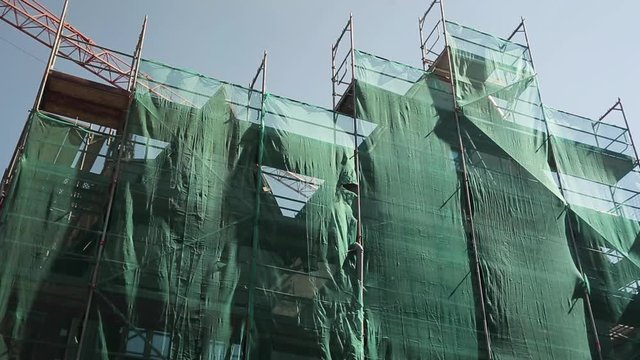 Construction Platform Covered in Green Safety Mesh