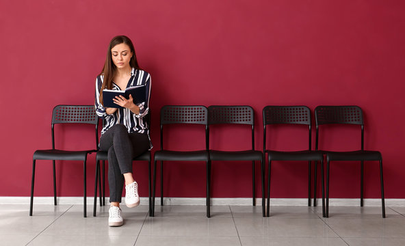 Young woman waiting for job interview indoors