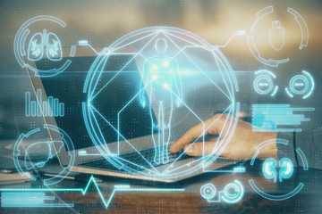 Science hologram with man working on computer on background. Concept of study. Double exposure.