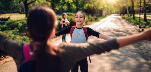 Girlfriends meet again on first day of school