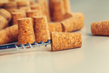 corkscrew for open wine cork bottle on wooden background