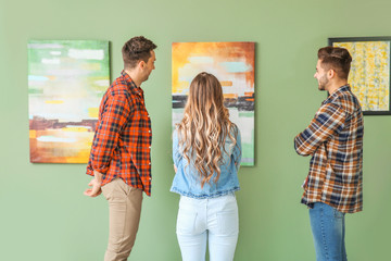 People at exhibition in modern art gallery
