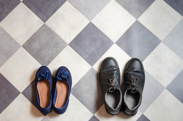 light and comfortable blue women's shoes and man's shoes on  black and white checkered floor