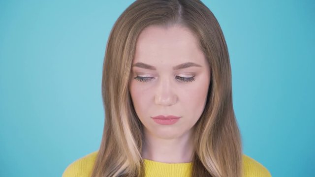Close up portrait of a woman with an angry face. Isolated on white. Facial expressions and emotions. 4K