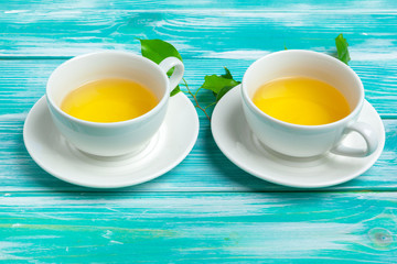 healthy herbal tea over blue background