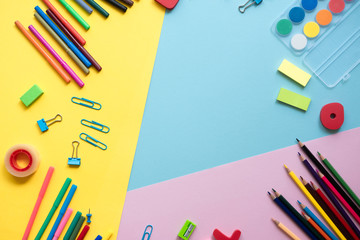 Fototapeta premium School supplies lay on color background, back to school concept, copy space