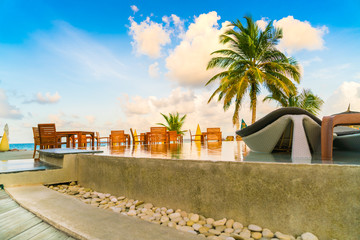 Fototapeta premium Table and chairs at restaurant in tropical Maldives island .