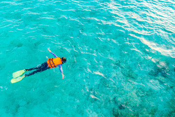 Snorkeling in tropical Maldives island .