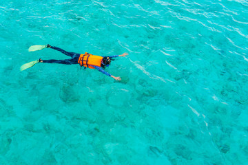 Snorkeling in tropical Maldives island .