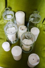 The candles, glassware and green drapery.