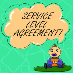 Word writing text Service Level Agreement. Business concept for Commitment between a service provider and a client Baby Sitting on Rug with Pacifier Book and Blank Color Cloud Speech Bubble