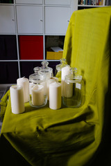 The candles, glassware and green drapery.