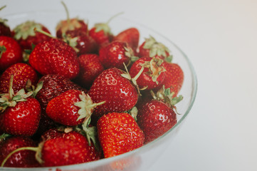 Strawberries in a transparent bowl