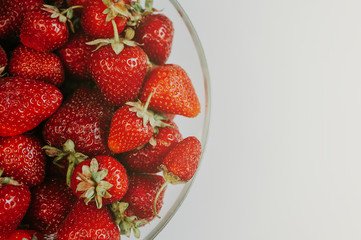 Strawberries in a transparent bowl
