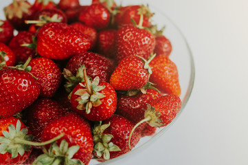 Strawberries in a transparent bowl