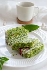 Spinach and raspberry cake with a cup of aromatic coffee. Beautiful and romantic breakfast