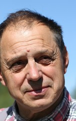 Smiling farmer outside.