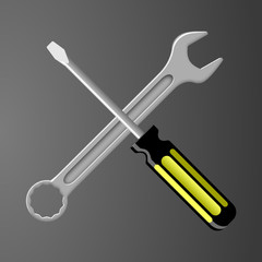 steel wrench crossed with a back and yellow screwdriver