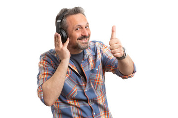 Fototapeta premium Man making thumb up gesture listening to music