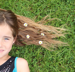 portrait of a girl and daisy in hair