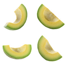 set of slices of avocado isolated on white background