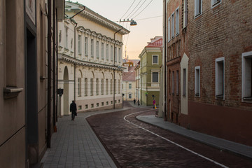 Narrow street in the Old Town of Vilnius at sunrise. Lithuania