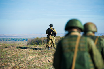 Russian special forces soldiers with weapon take part in military maneuver