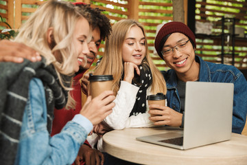 Happy multhietnic friends hanging out together