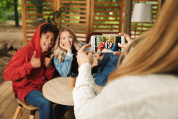 Happy multhietnic friends hanging out together