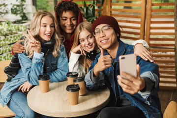 Group if cheerful multiethnic friends teenagers