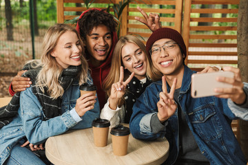 Group if cheerful multiethnic friends teenagers