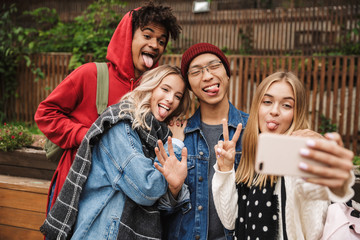 Group if cheerful multiethnic friends teenagers