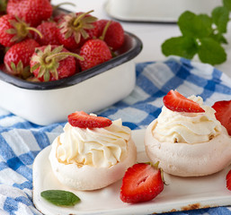 baked meringue with cream and fresh strawberries