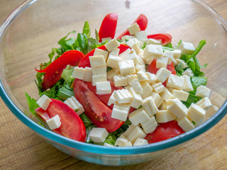 Top view healthy greek salad with vegetables
