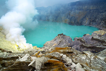 SMOKE OF SULFUR ON KAWAH IJEN VOLCANO IN JAVA ISLAND-INDONESIA