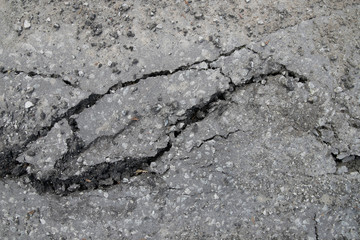 Cracked surface of an asphalt road