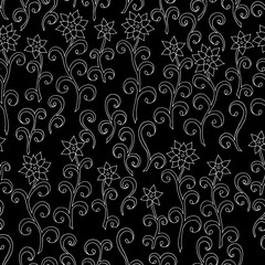 Seamless pattern of doodle flowers on dark background