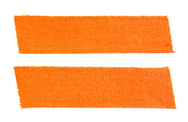 Two pieces of orange matte cloth gaffer tape isolated on white background.